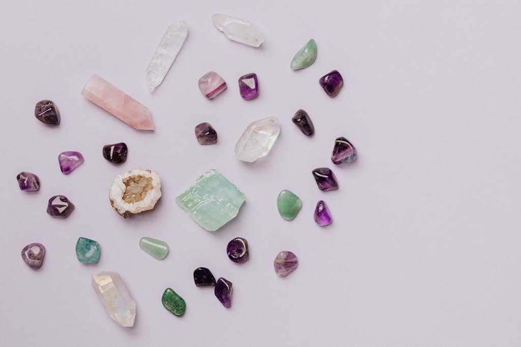 Lola Jade Fielder-Civil A collection of various crystals and gemstones arranged on a minimalist light surface.