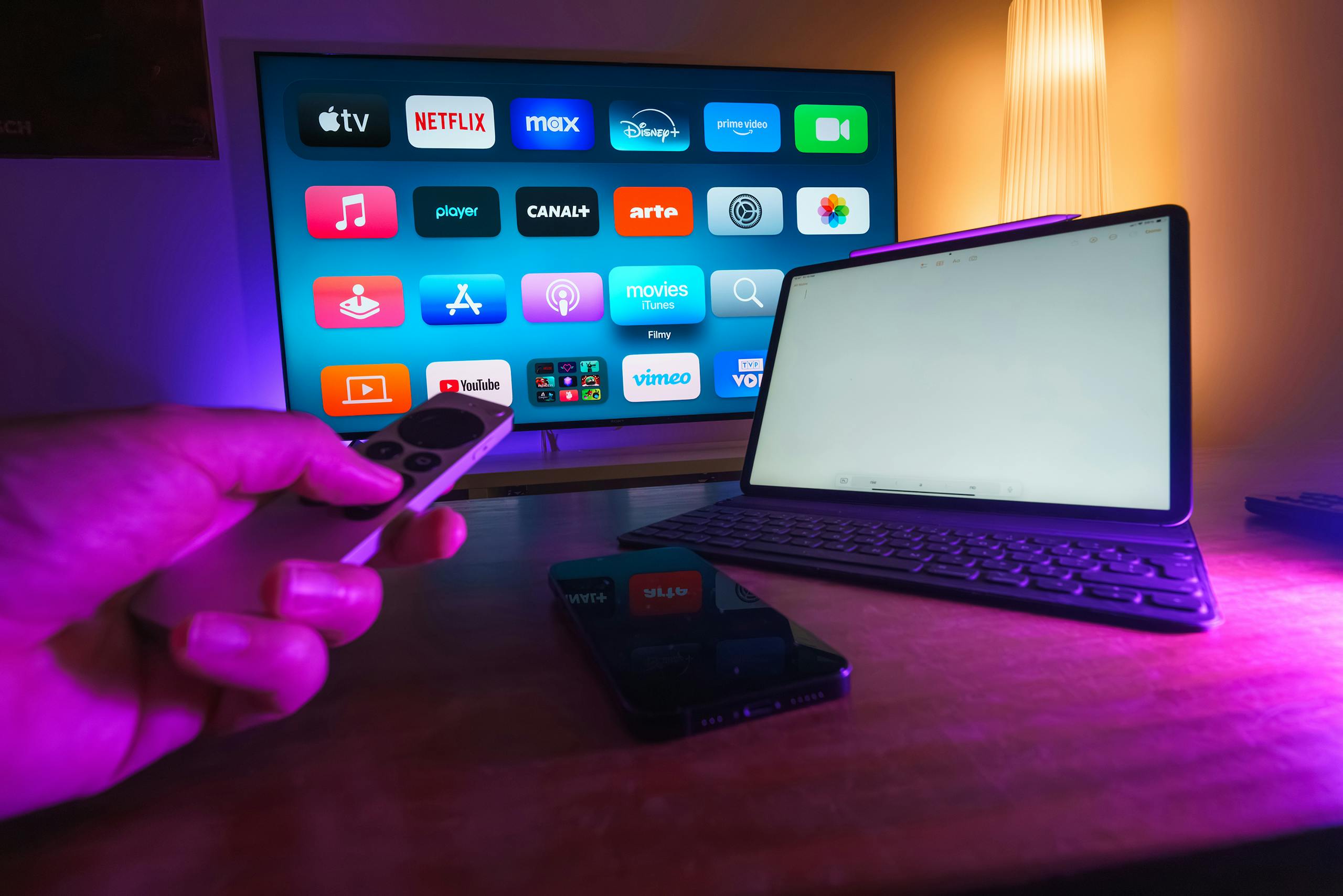 CHAS6D cozy home setup featuring streaming services on smart TV, tablet, and smartphone.
