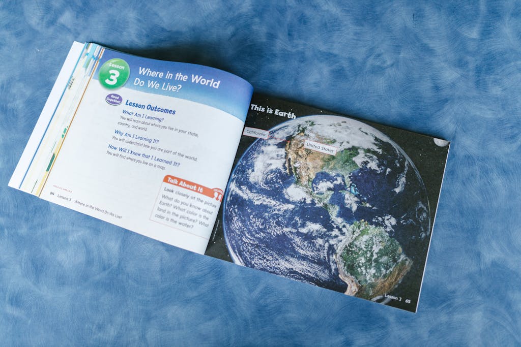 Twastia com About Us An open educational book displaying a world map and lesson outcomes about global locations.