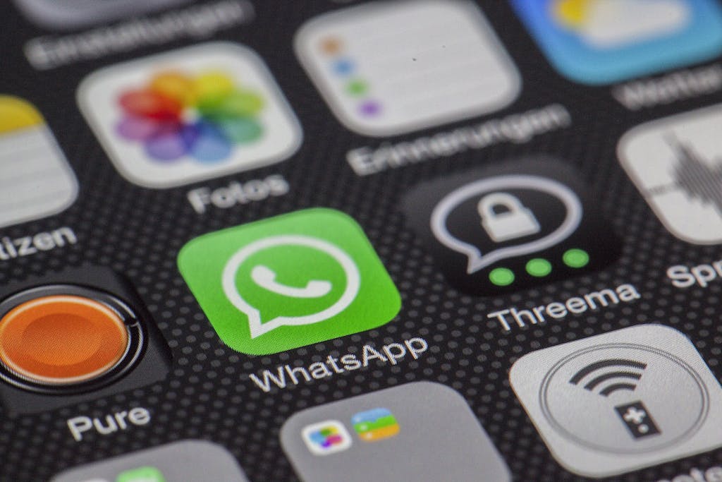 CHAS6D Globe and Mail App Detailed macro of smartphone screen showcasing popular app icons like WhatsApp.