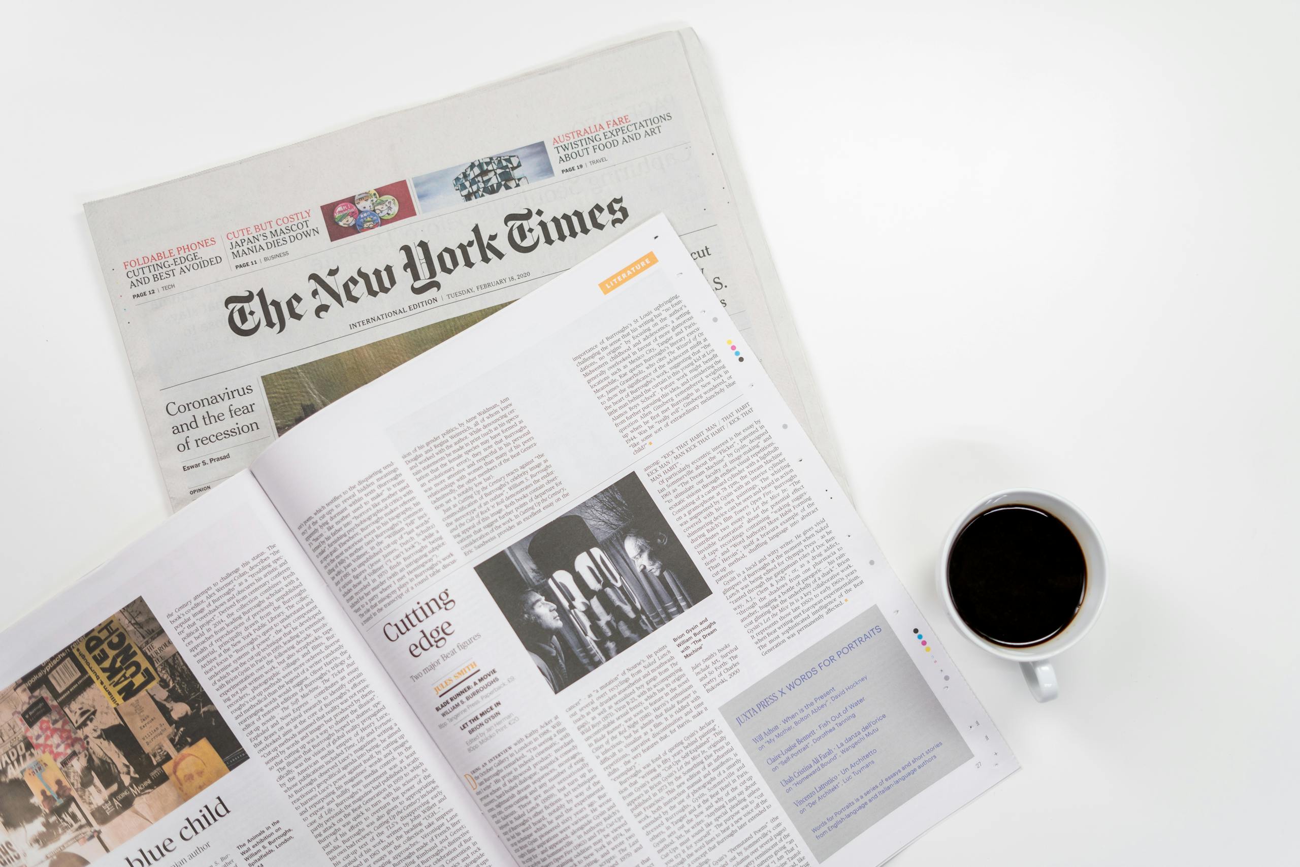 CBS News Flat lay of a coffee cup and The New York Times newspaper, ideal for business and lifestyle themes.