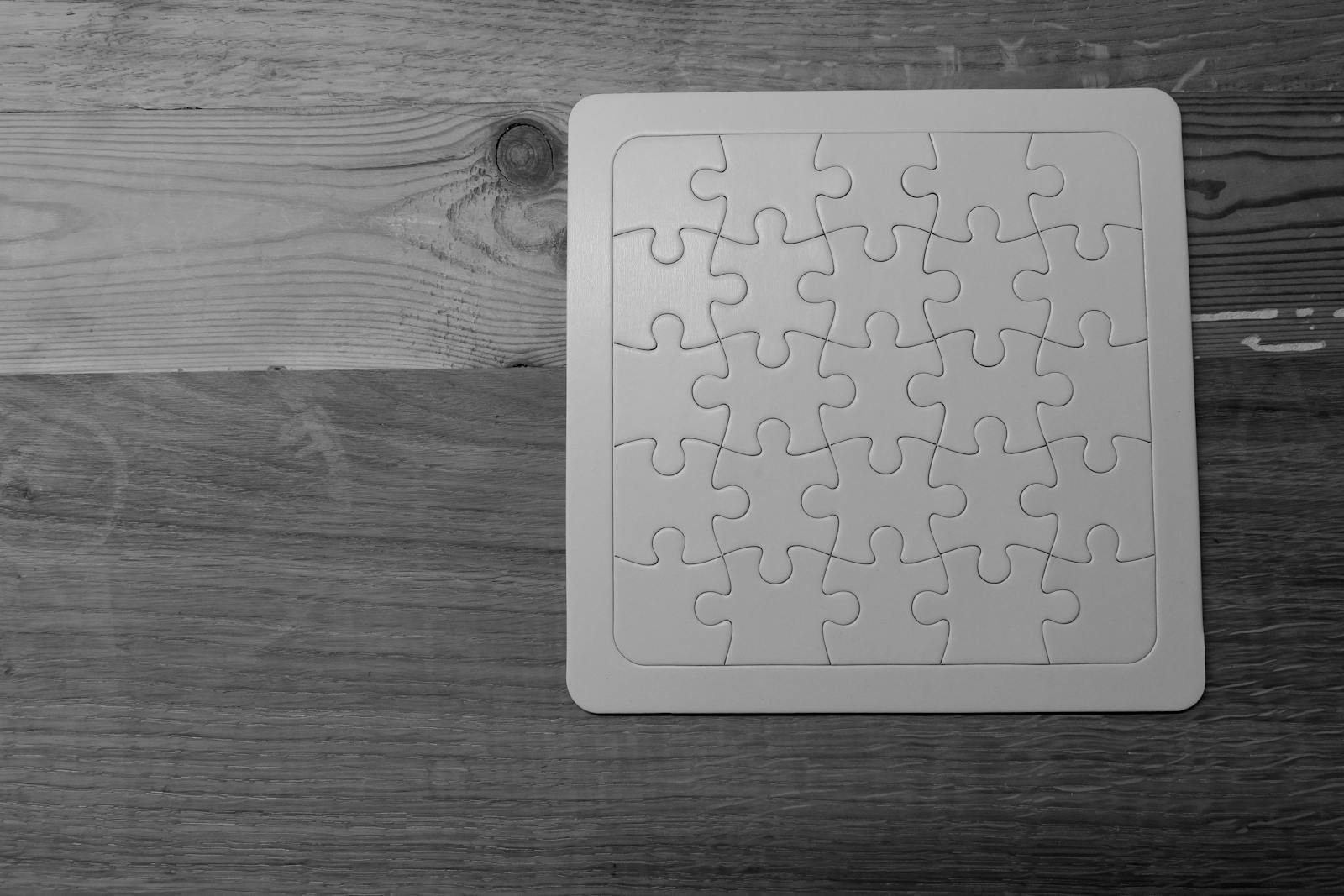 Naruto Senki Game – Complete In-Depth Article Black and white image of a completed puzzle on a wooden table.