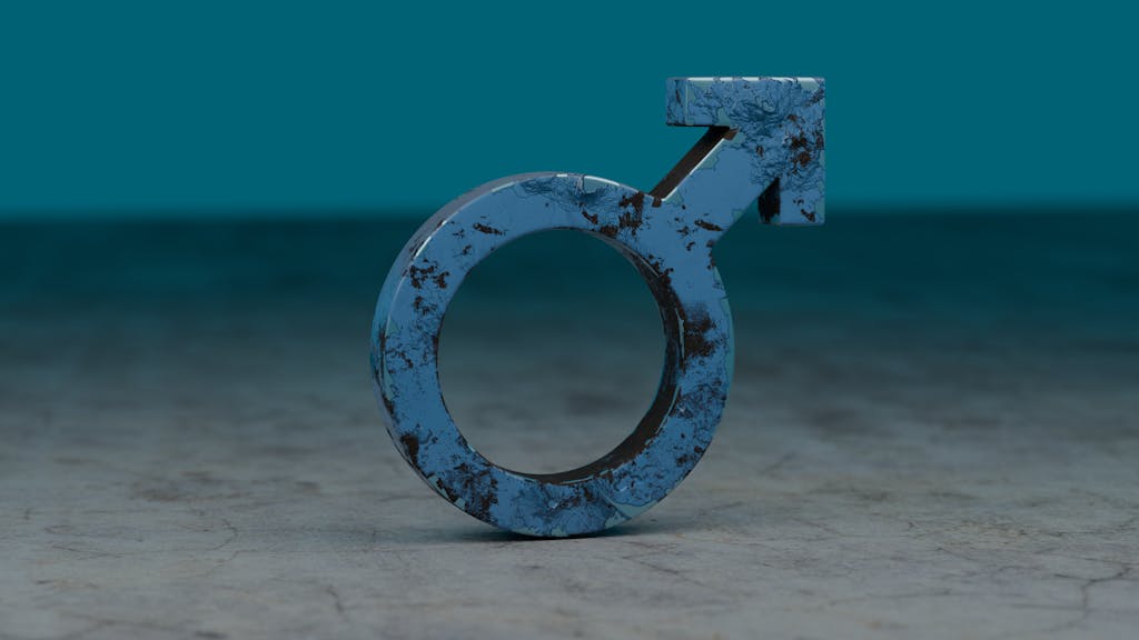 Asian Pinay A weathered blue male gender symbol stands amidst a muted background, symbolizing masculinity.