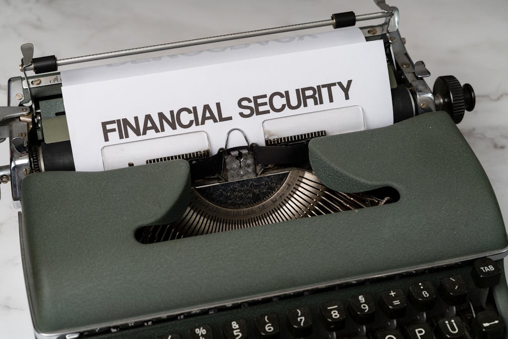 Economic Weekly News Close-up of a vintage typewriter with 'Financial Security' typed on paper, representing financial themes.