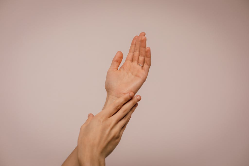 Skin Care in Hindi Wellhealthorganic Close-up of hands gently caressing each other, symbolizing self-care and softness.