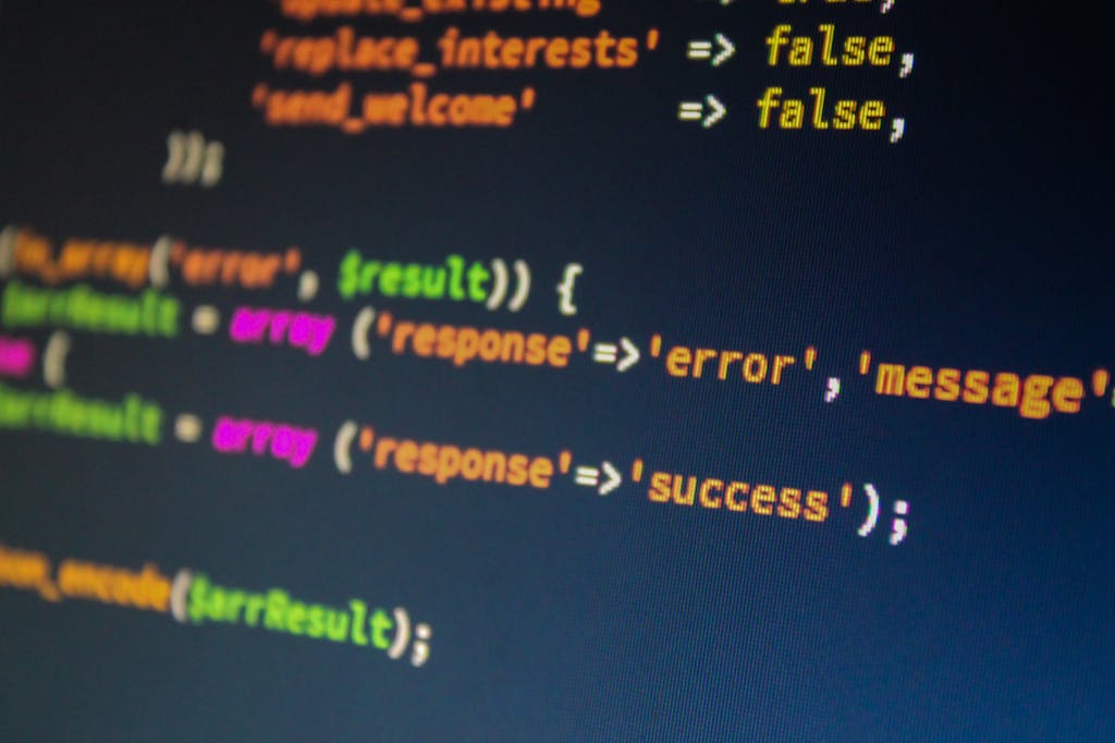 Pxless Design: Close-up of PHP code on a monitor, highlighting development and programming concepts.