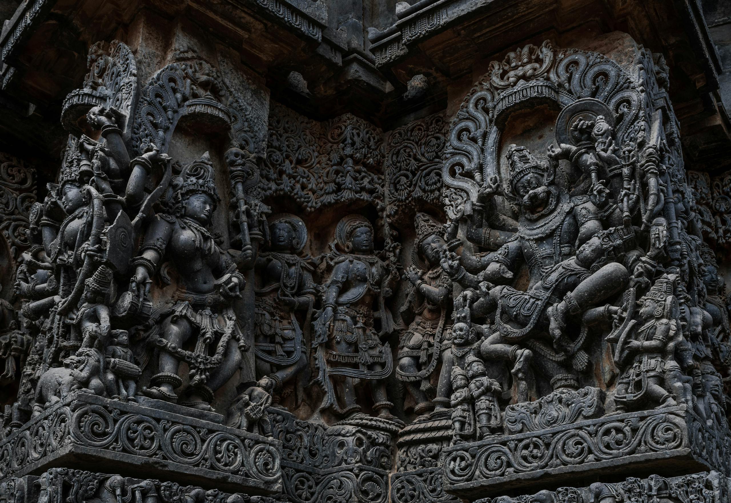 Hindu Temple Near Me: Detailed stone carvings at Halebidu temple, depicting Hindu gods and mythology.