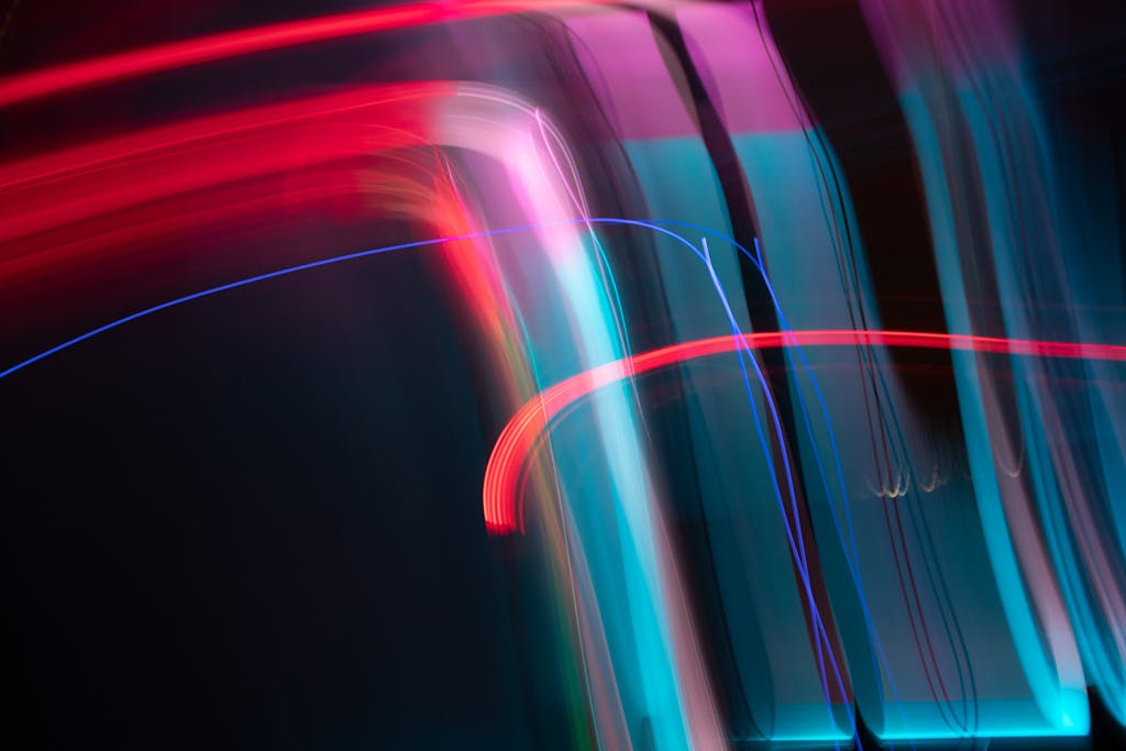 Dynamic and colorful long exposure light streaks in an abstract artistic composition.