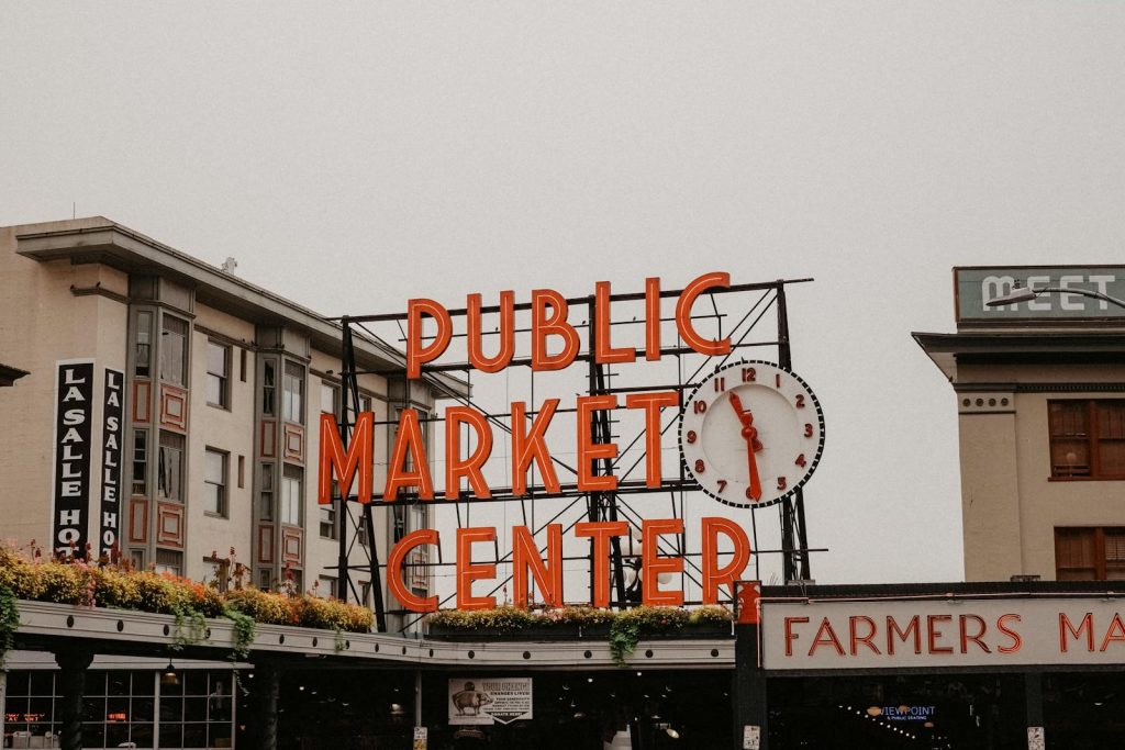 The famous Public Market Center sign at Pike Place Market in Seattle, a must-visit attraction.