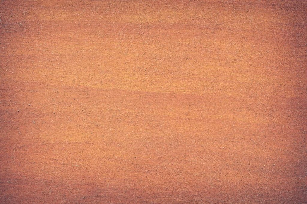 edivawer Vibrant orange textured surface, perfect for design backdrops and creative projects.