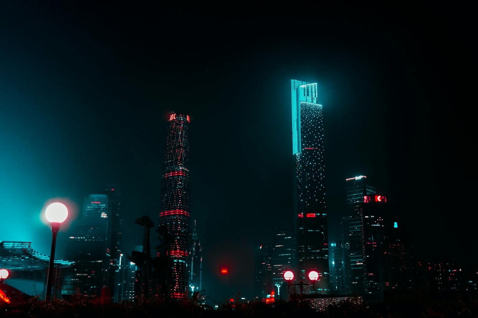 whatsontech Stunning night view of Guangzhou's skyline with brightly lit skyscrapers creating a mesmerizing urban landscape.