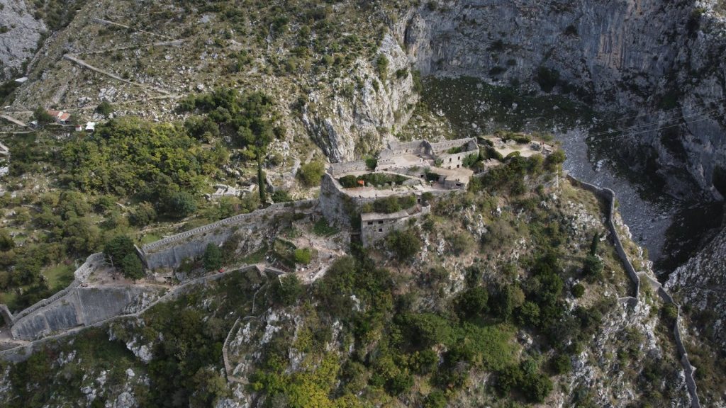 ibomma1.com Stunning view of ancient fortification in Kotor, Montenegro from above. Perfect for travel and history themes.