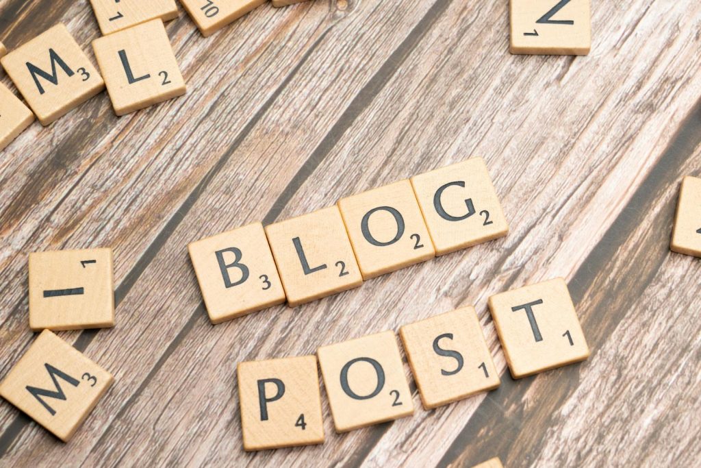 Ventsmagazine.cloud Wooden letter tiles spelling 'Blog Post' on a wooden background, ideal for online media concepts.