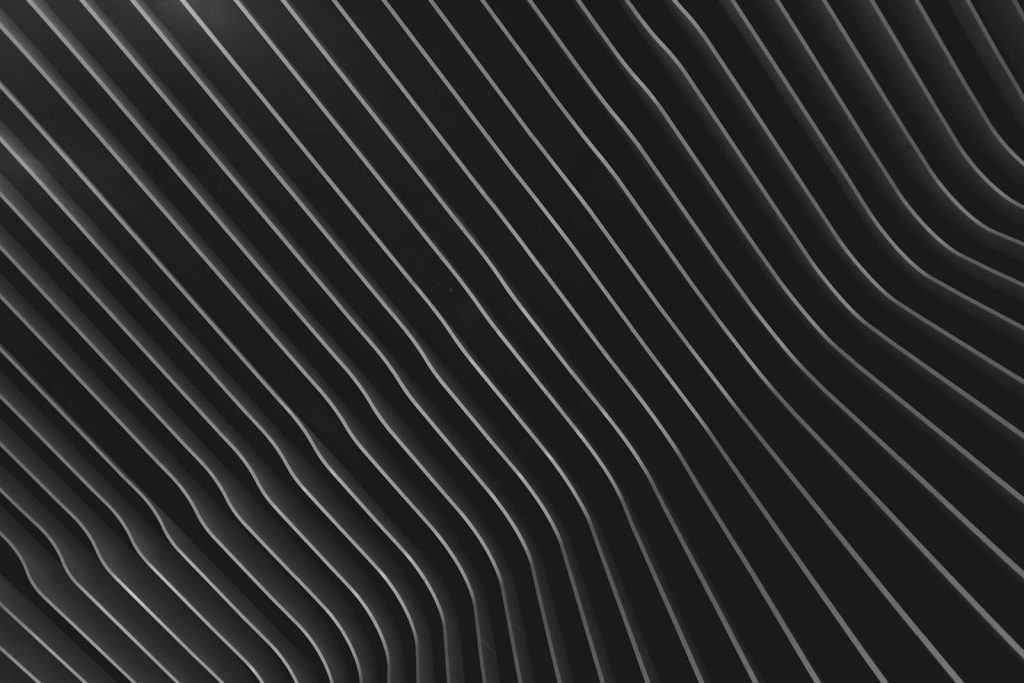 whatsontech Stylish abstract black wave pattern conveying depth and texture, perfect for backgrounds and design projects.