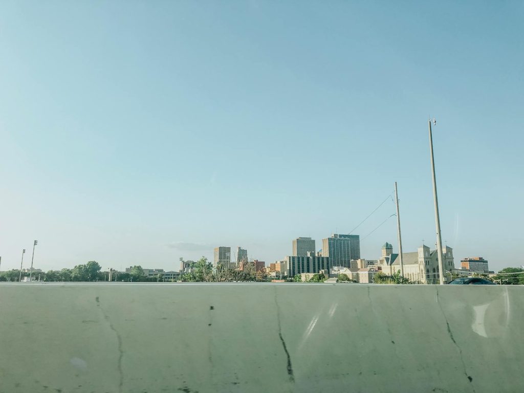 Scenic view of downtown Dayton skyline under a clear blue sky, ideal for urban landscapes.