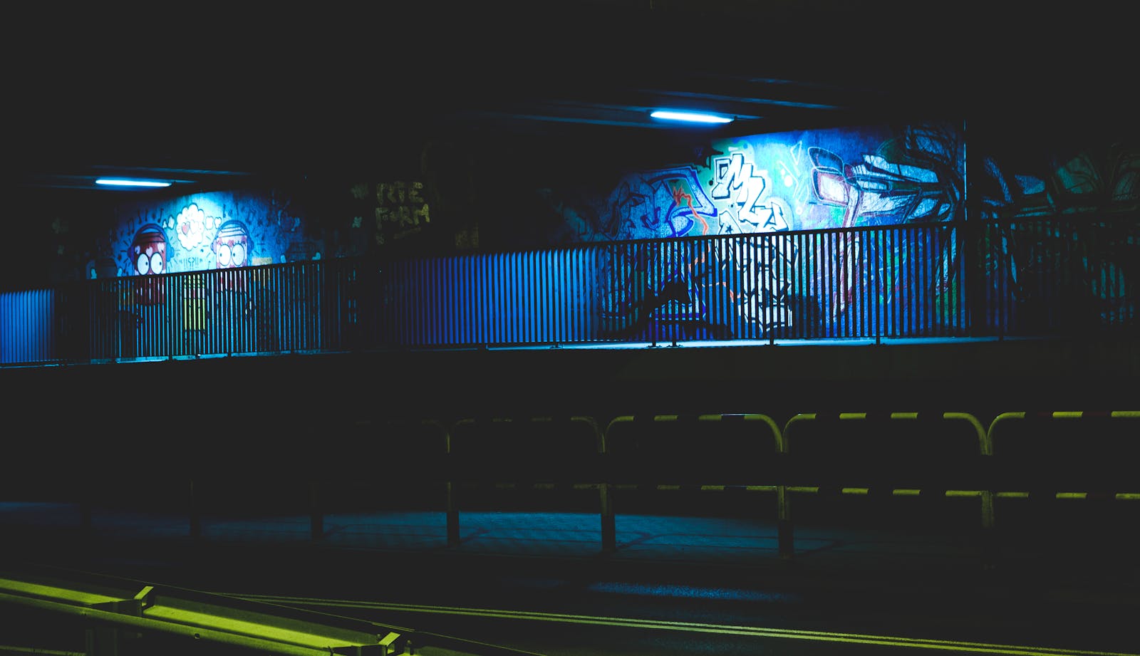 Messeregge: A Complete Guide to Meaning, Uses, Importance, and Future Scope Illuminated urban graffiti under a bridge at night, with vibrant colors and street art.