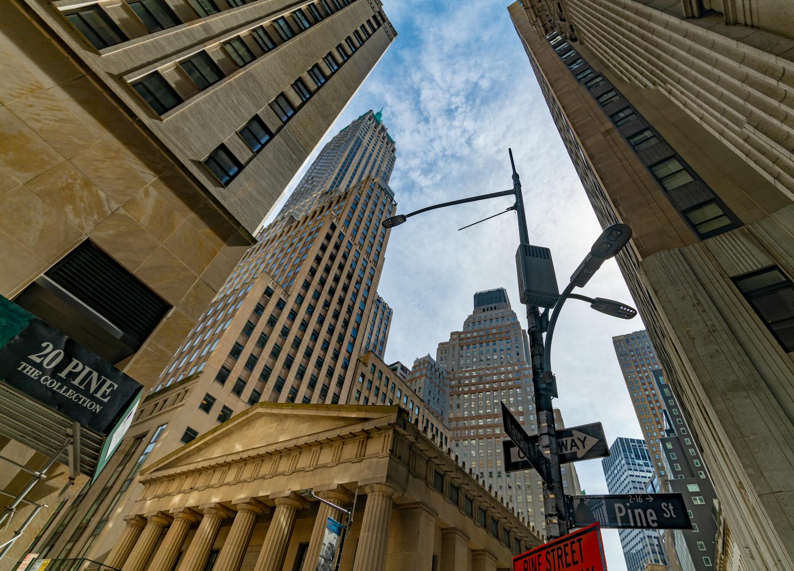 The Rise of Business News ChannelsLow-angle view of skyscrapers in New York City's Financial District on a clear day.