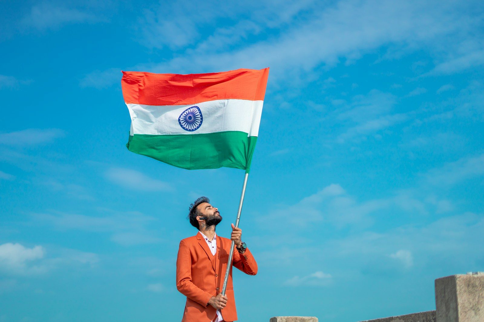 The Rise of Digital Hindi News Platforms in IndiaThe Rise of Digital Hindi News Platforms in Indiaa man holding a flag