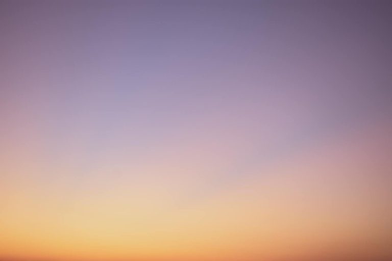 Finnorth serene gradient sky with hues of blue, pink, and orange during twilight.