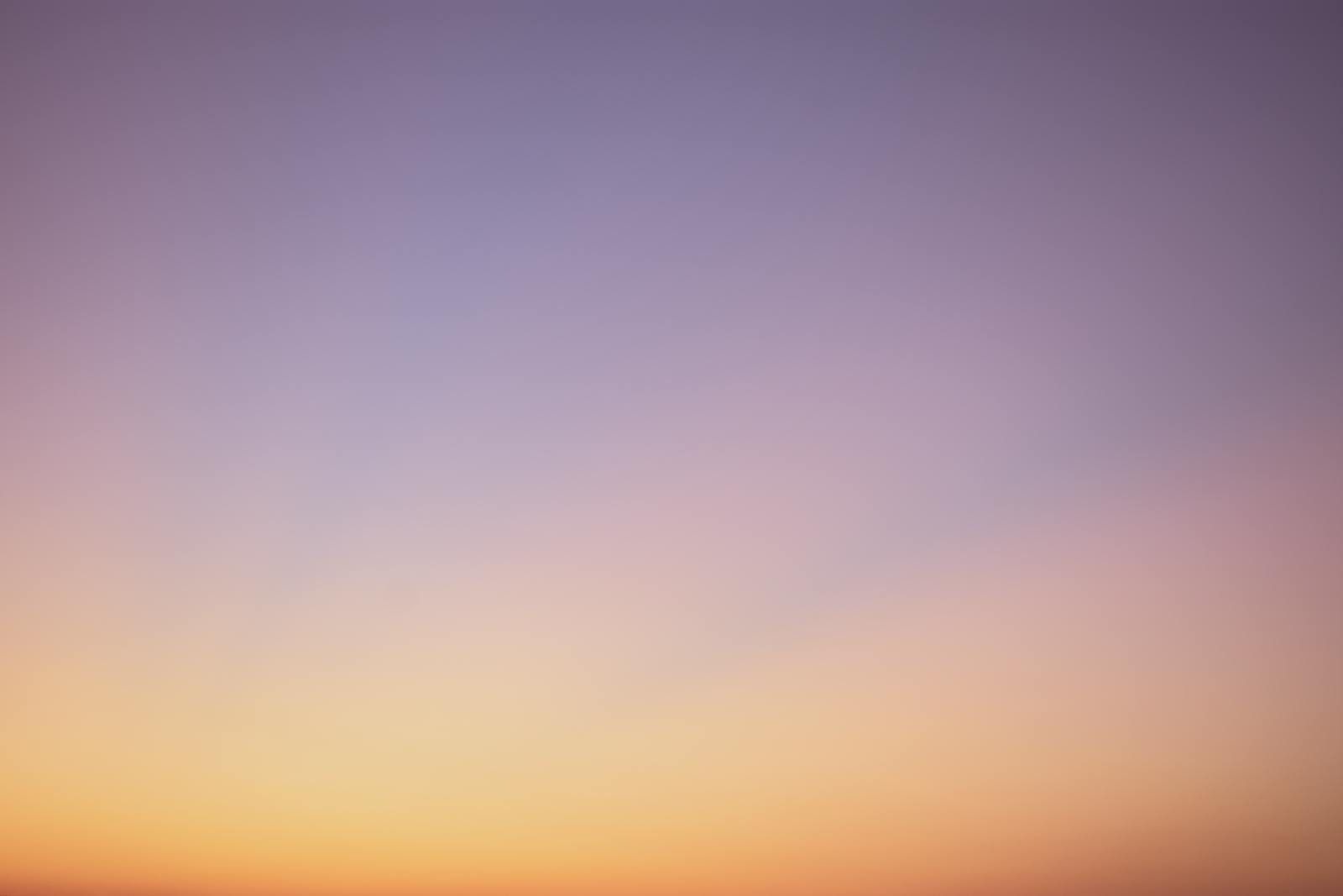 Finnorth serene gradient sky with hues of blue, pink, and orange during twilight.
